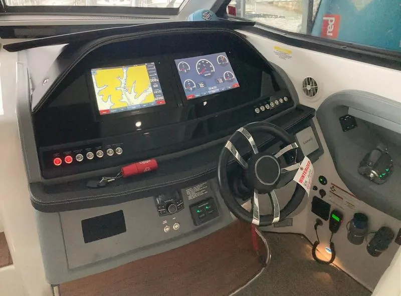 Slide: The Image of 2018 Cobalt A40 Coupe dashboard with navigation screens and steering wheel. - 24