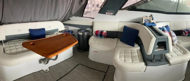 Slide: The Image of Interior of 2018 Cobalt A40 Coupe with white leather seating and wooden table. - 8