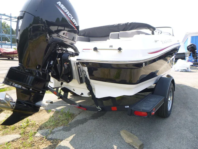Slide: The Image of 2023 Tahoe 200 S boat with Mercury outboard motor on trailer. - 4