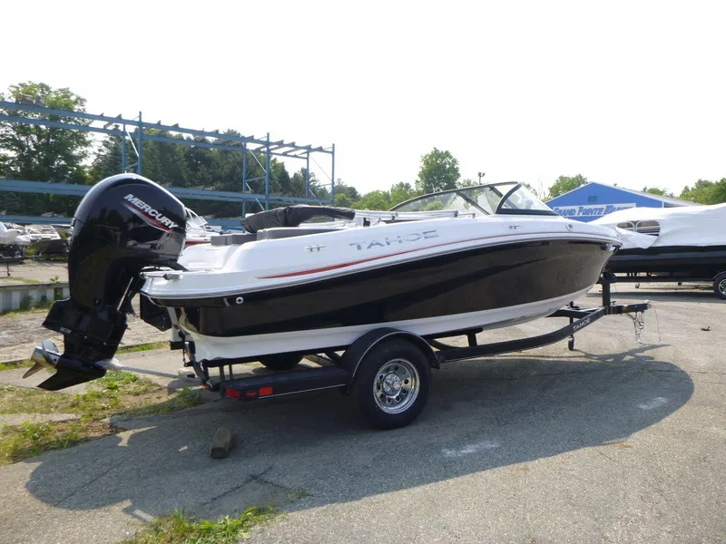 Slide: The Image of 2023 Tahoe 200 S boat on trailer, black and white design, outdoor display. - 5