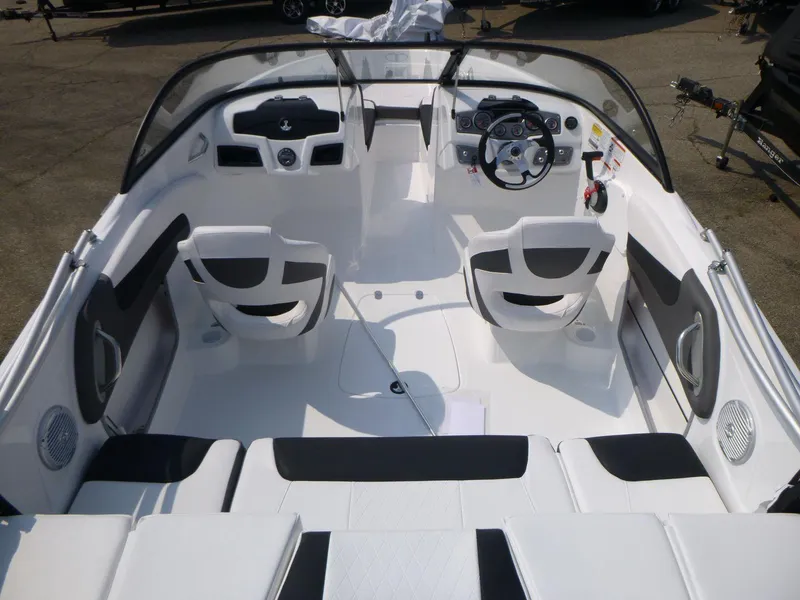 Slide: The Image of 2023 Tahoe 200 S boat interior with sleek white seating and modern dashboard. - 6