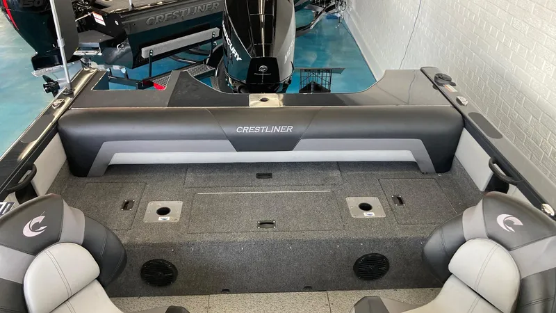 Slide: The Image of 2024 Crestliner 2050 Sportfish boat interior with seating and storage compartments. - 3