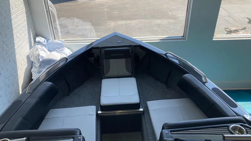 Slide: The Image of 2024 Crestliner 2050 Sportfish boat interior with cushioned seating. - 8