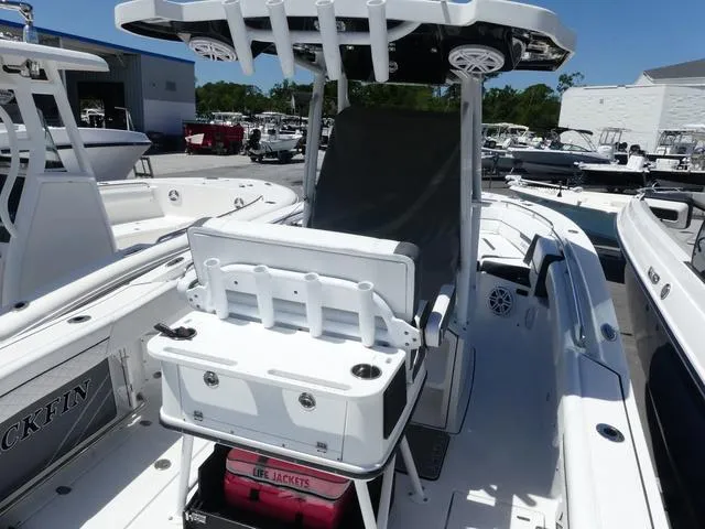 Slide: The Image of 2022 Blackfin 252CC boat interior with seating, storage, and fishing rod holders. - 6