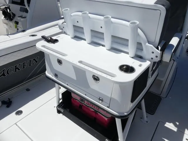 Slide: The Image of 2022 Blackfin 252CC boat with fishing rod holders and storage compartment. - 7