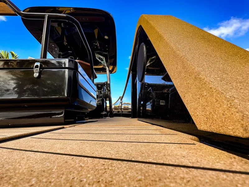 Slide: The Image of 2023 X Shore Eelex 8000 electric boat docked under a clear blue sky. - 9