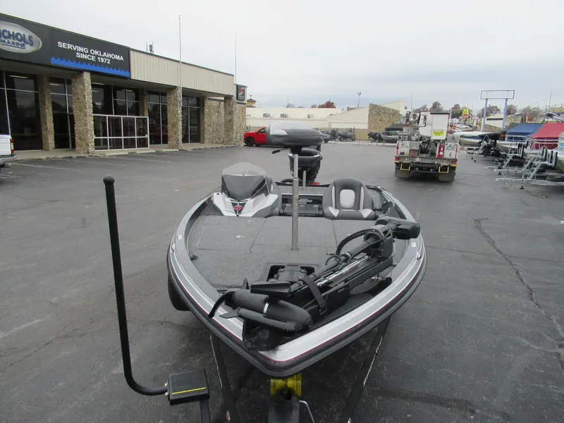 Slide: The Image of 2023 Ranger Z518 boat parked outside dealership, showcasing sleek design and advanced features. - 4