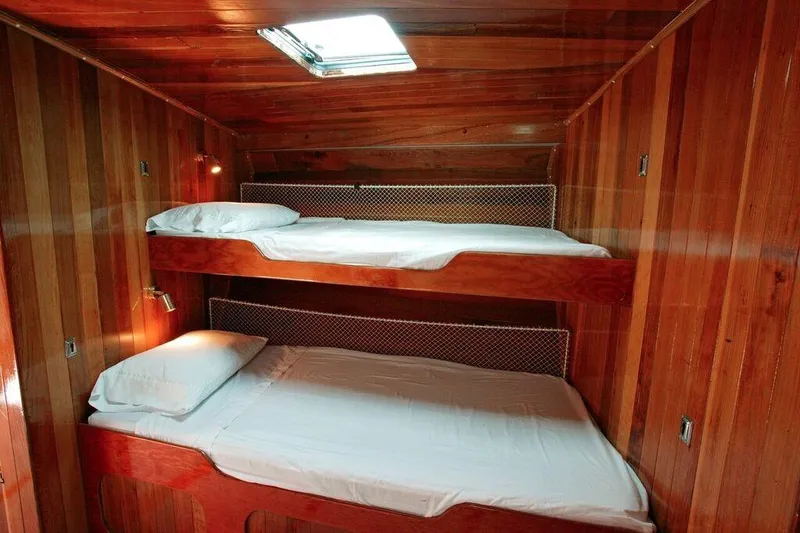Slide: The Image of Wood-paneled bunk beds in 1996 Custom 100' Sailing Yacht cabin. - 12