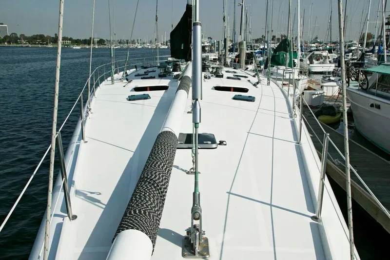 Slide: The Image of 1996 Custom 100' Sailing Yacht docked at marina, view of deck and mast. - 20
