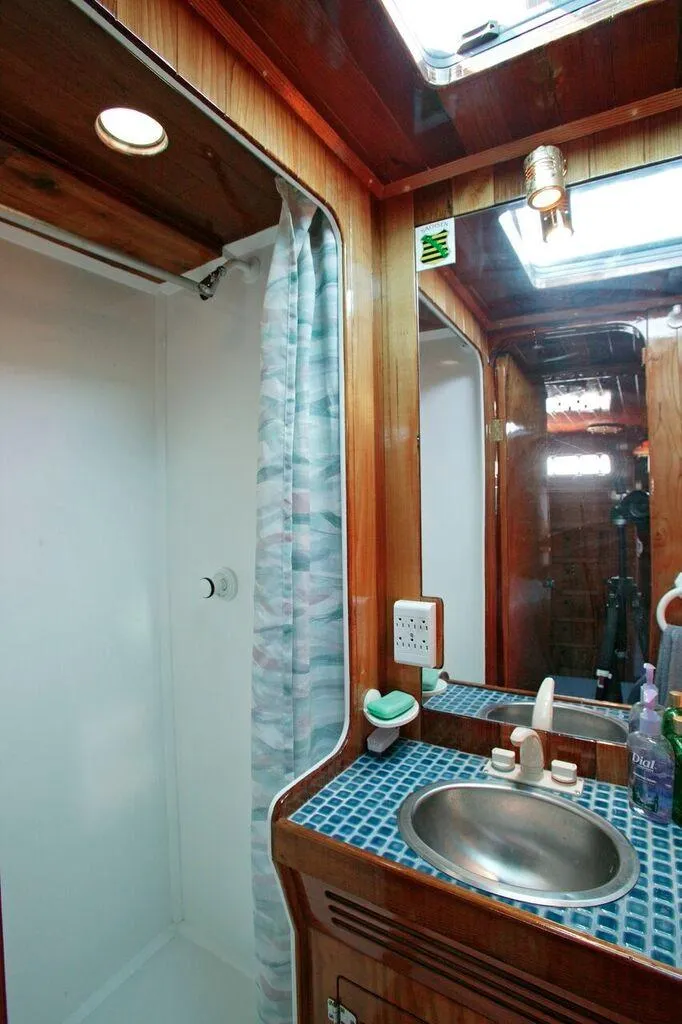 Slide: The Image of 1996 Custom 100' Sailing Yacht bathroom with shower and sink. - 28