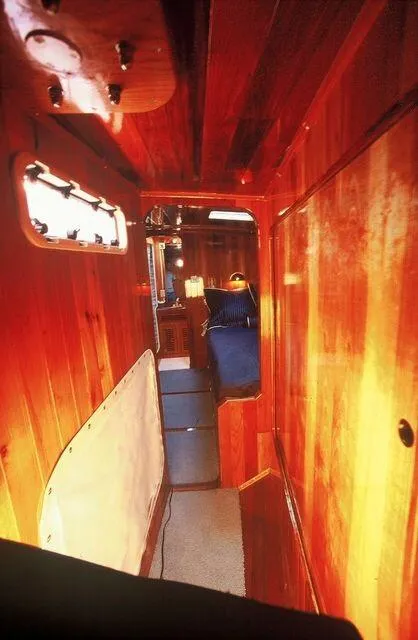 Slide: The Image of Interior hallway of a 1996 Custom 100' Sailing Yacht with wooden paneling. - 30