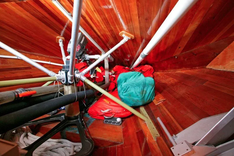 Slide: The Image of Interior of a 1996 Custom 100' Sailing Yacht with wooden panels and equipment. - 35