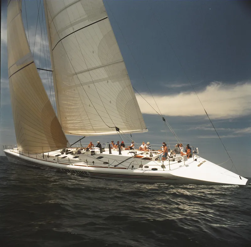 Slide: The Image of Custom 100' sailing yacht from 1996 on open water, with crew onboard. - 38