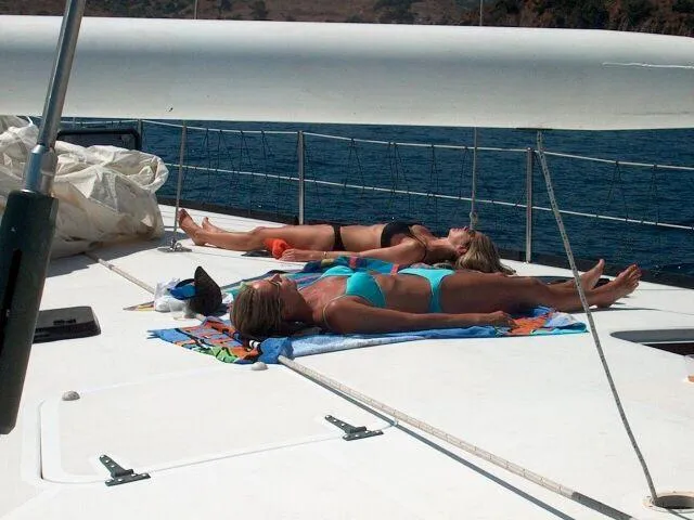 Slide: The Image of People sunbathing on the deck of a 1996 Custom 100' Sailing Yacht. - 43