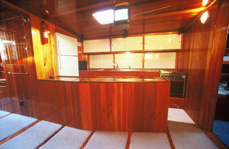 Slide: The Image of Luxurious wooden kitchen interior on a 1996 Custom 100' Sailing Yacht. - 5