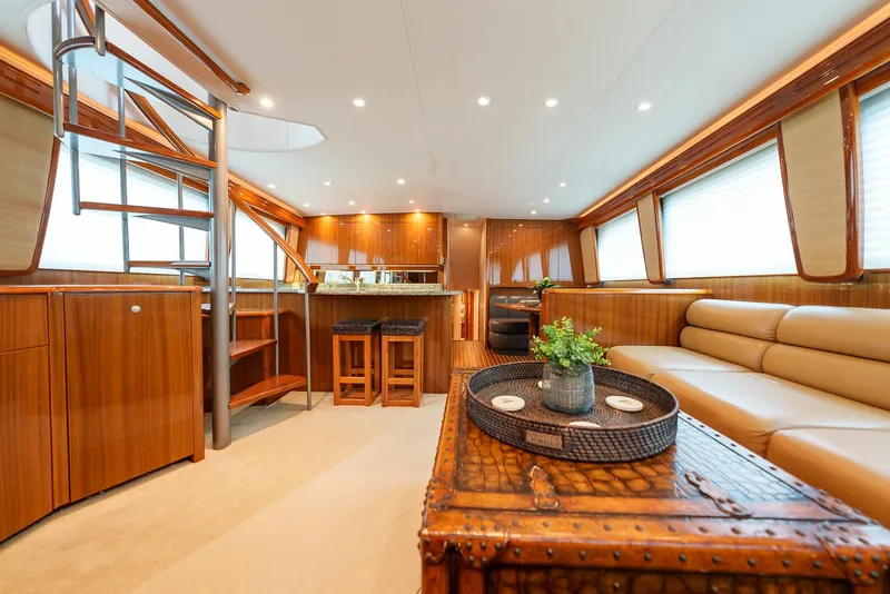 Slide: The Image of Luxurious interior of 2008 Viking 68 Skybridge yacht with modern furnishings and spiral staircase. - 7