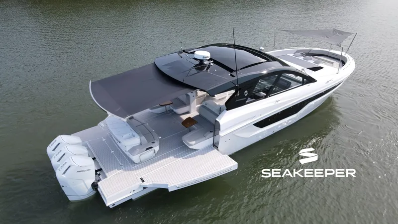 The Image of 2025 Cruisers Yachts 50 GLS Outboard on water, featuring Seakeeper stabilization. - 0