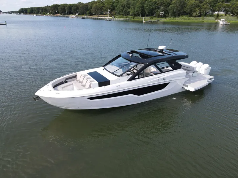 Slide: The Image of 2025 Cruisers Yachts 50 GLS Outboard on calm water. - 11