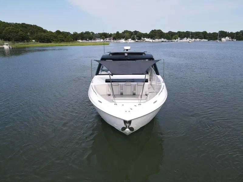 Slide: The Image of 2025 Cruisers Yachts 50 GLS Outboard on calm water. - 29