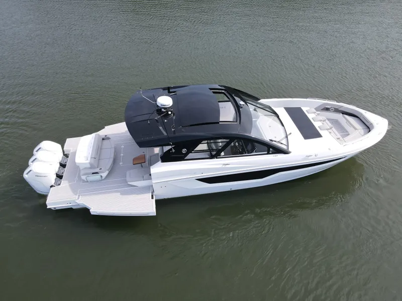 Slide: The Image of 2025 Cruisers Yachts 50 GLS Outboard on water, aerial view. - 16