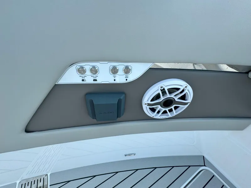 Slide: The Image of Control panel and speaker on the 2025 Cruisers Yachts 50 GLS Outboard. - 48