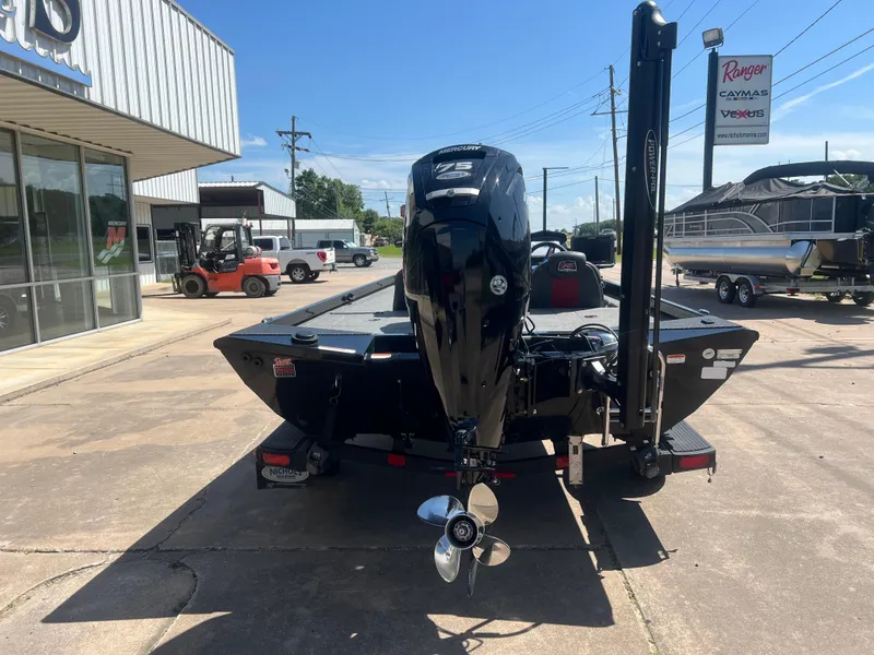 Slide: The Image of 2023 Ranger RT178C boat with outboard motor, displayed at a dealership. - 3