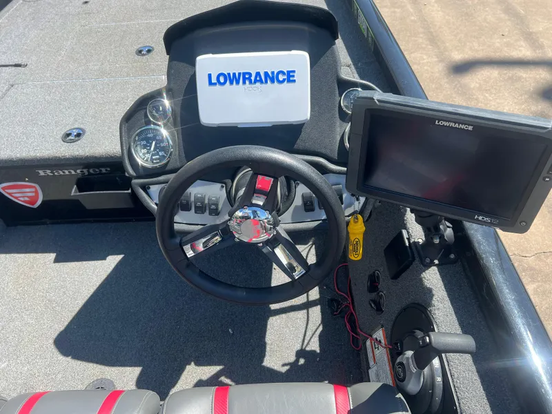 Slide: The Image of 2023 Ranger RT178C boat dashboard with Lowrance electronics and steering wheel. - 5
