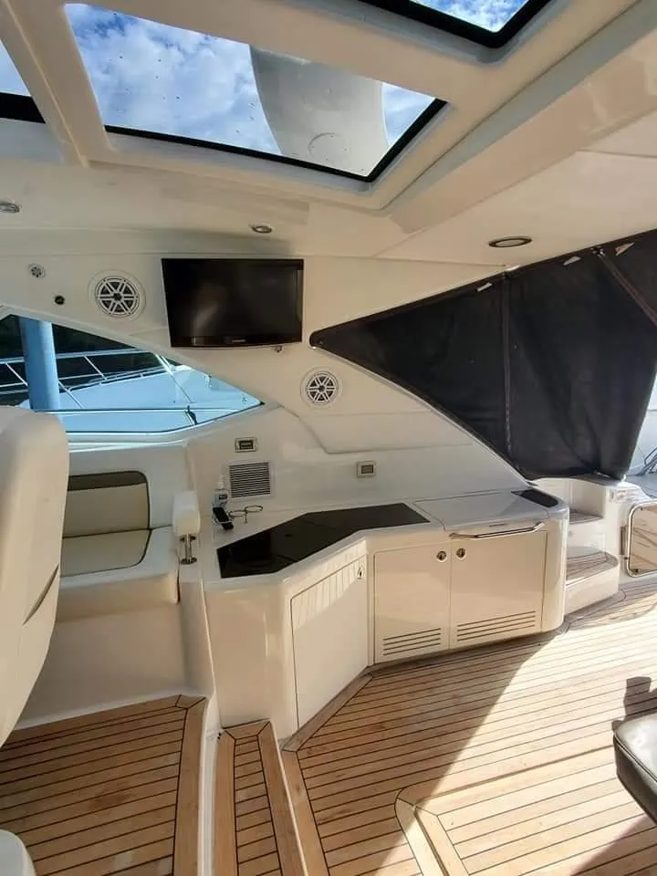 Slide: The Image of Luxurious 2012 Sea Ray 540 Sundancer yacht interior with wood flooring and modern amenities. - 10