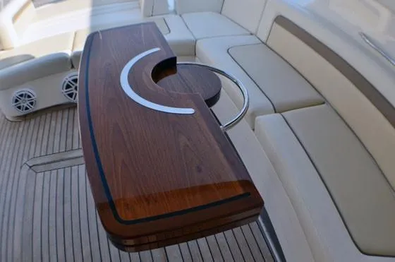 Slide: The Image of Luxurious seating area on 2012 Sea Ray 540 Sundancer yacht with elegant wooden table. - 16