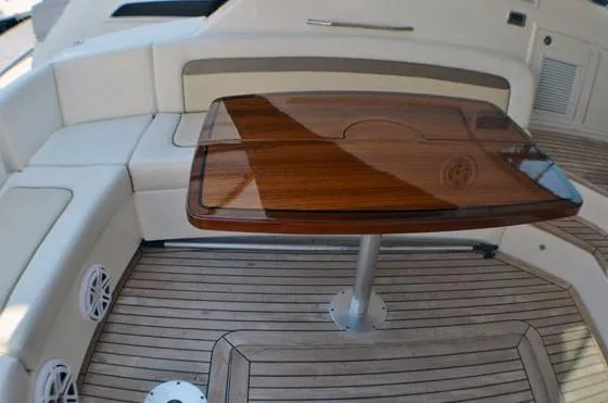 Slide: The Image of Luxurious 2012 Sea Ray 540 Sundancer yacht interior with elegant wood table and seating. - 17