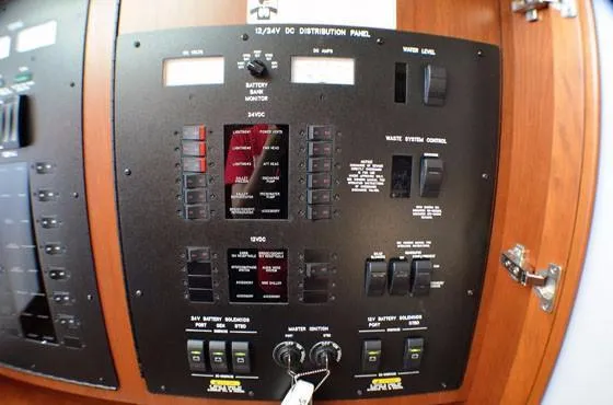 Slide: The Image of Control panel of 2012 Sea Ray 540 Sundancer yacht, featuring switches and gauges. - 23