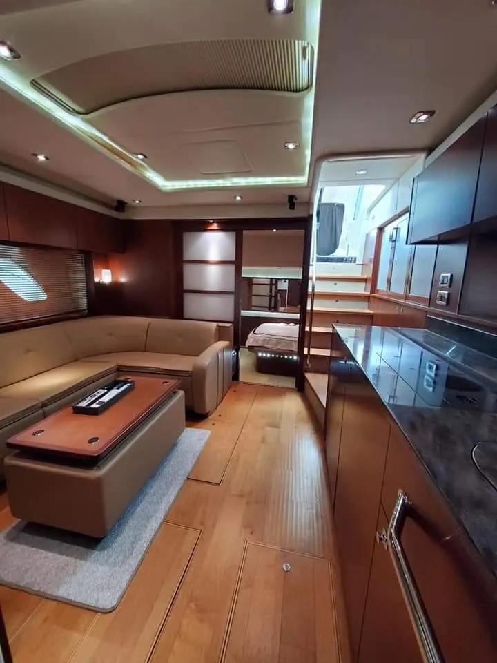 Slide: The Image of Luxurious interior of 2012 Sea Ray 540 Sundancer yacht with modern furnishings. - 29