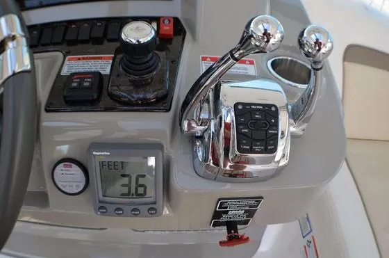 Slide: The Image of Control panel of 2012 Sea Ray 540 Sundancer yacht with digital display and throttle levers. - 9