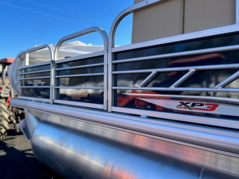 Slide: The Image of 2023 Sun Tracker FISHIN' BARGE® 22 XP3 pontoon boat side view. - 4