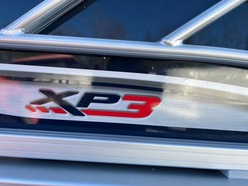 Slide: The Image of 2023 Sun Tracker FISHIN' BARGE® 22 XP3 logo on boat exterior. - 6