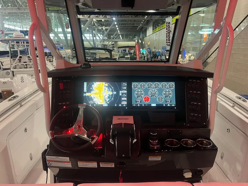Slide: The Image of 2023 Blackfin 332 CC boat dashboard with advanced navigation and control systems. - 15