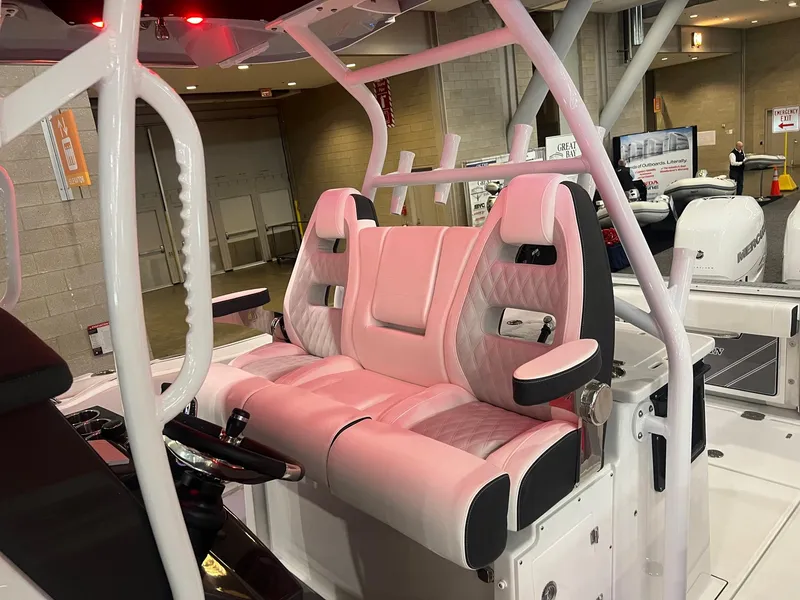 Slide: The Image of 2023 Blackfin 332 CC boat interior with pink and white seating. - 17
