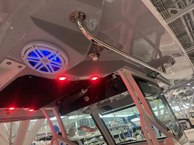 Slide: The Image of 2023 Blackfin 332 CC boat interior with blue speaker and red LED lights. - 18