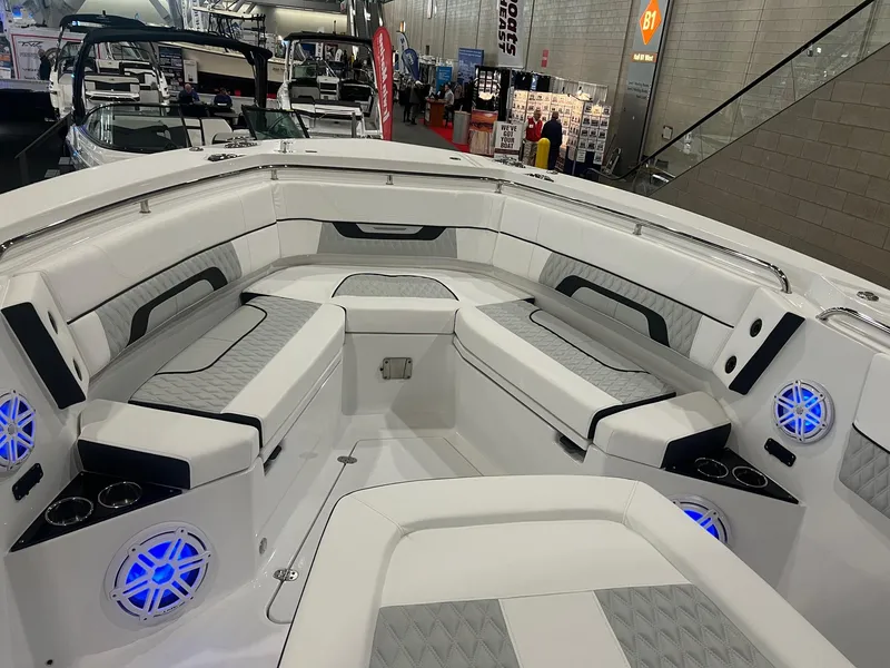 Slide: The Image of 2023 Blackfin 332 CC boat interior with seating and blue LED lights. - 25