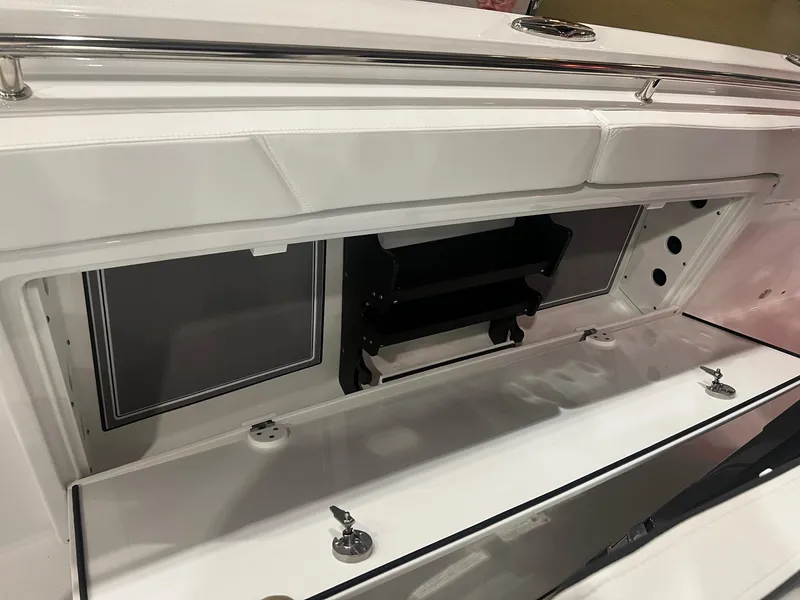 Slide: The Image of 2023 Blackfin 332 CC boat storage compartment with sleek white design. - 36