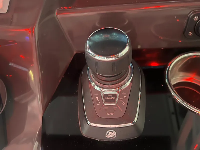 Slide: The Image of 2023 Blackfin 332 CC boat control panel with joystick and cup holder. - 37