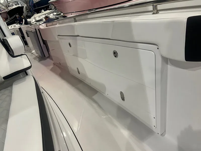 Slide: The Image of 2023 Blackfin 332 CC boat interior with sleek white storage compartments. - 38