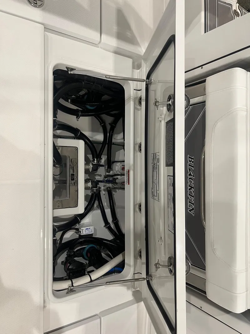 Slide: The Image of 2023 Blackfin 332 CC boat interior with open hatch and visible wiring. - 7