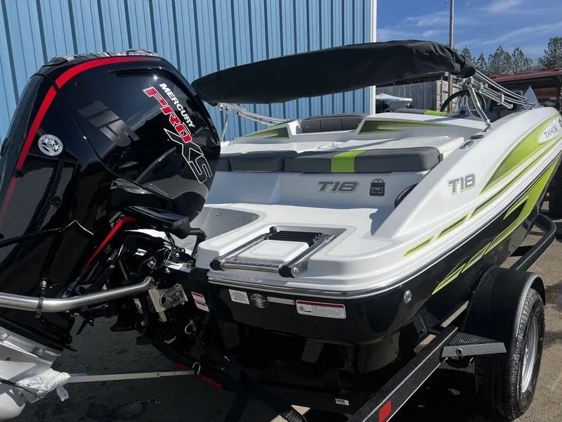 Slide: The Image of 2023 Tahoe T18 boat with Mercury Pro XS engine, parked outdoors. - 7