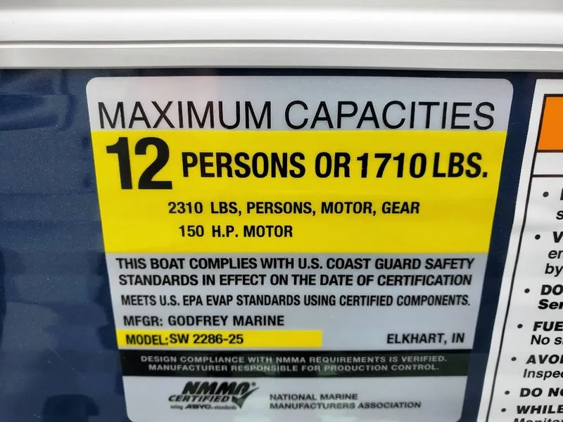 Slide: The Image of 2023 Sweetwater 2286 Xperience boat capacity label: 12 persons or 1710 lbs, 150 HP motor. - 10