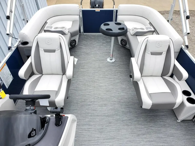 Slide: The Image of 2023 Sweetwater 2286 Xperience Split Bench OB interior with plush seating and table. - 4