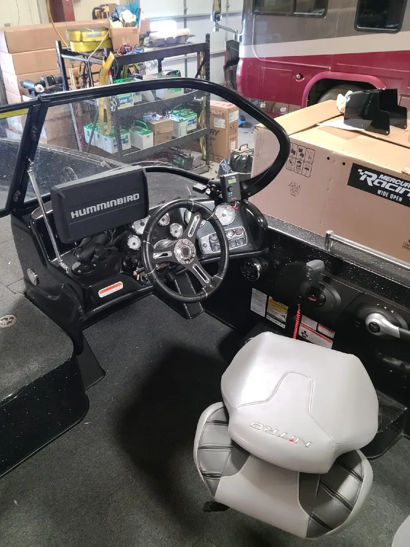 Slide: The Image of 2020 Nitro ZV19 Sport boat cockpit with Humminbird electronics and comfortable seating. - 17