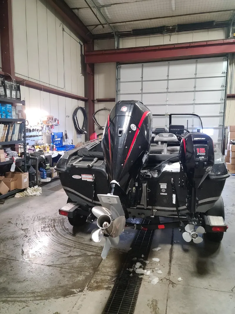 Slide: The Image of 2020 Nitro ZV19 Sport boat in a garage workshop. - 3