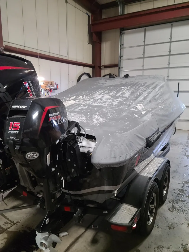 Slide: The Image of 2020 Nitro ZV19 Sport boat with cover in a garage. - 4