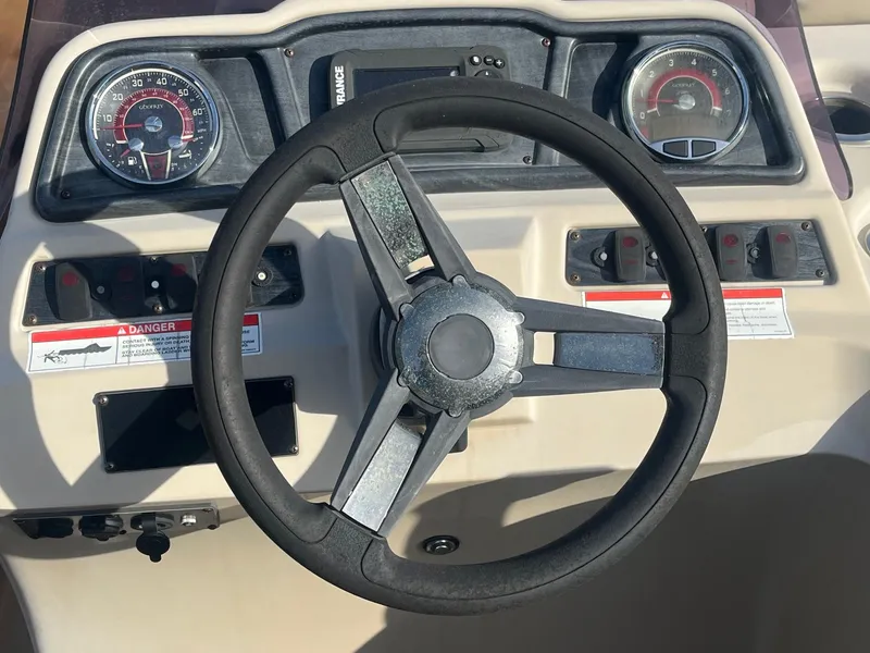Slide: The Image of Steering wheel and dashboard of 2020 Sweetwater 2286 SB boat. - 8